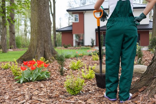 A professional landscaping team working safely on an outdoor project